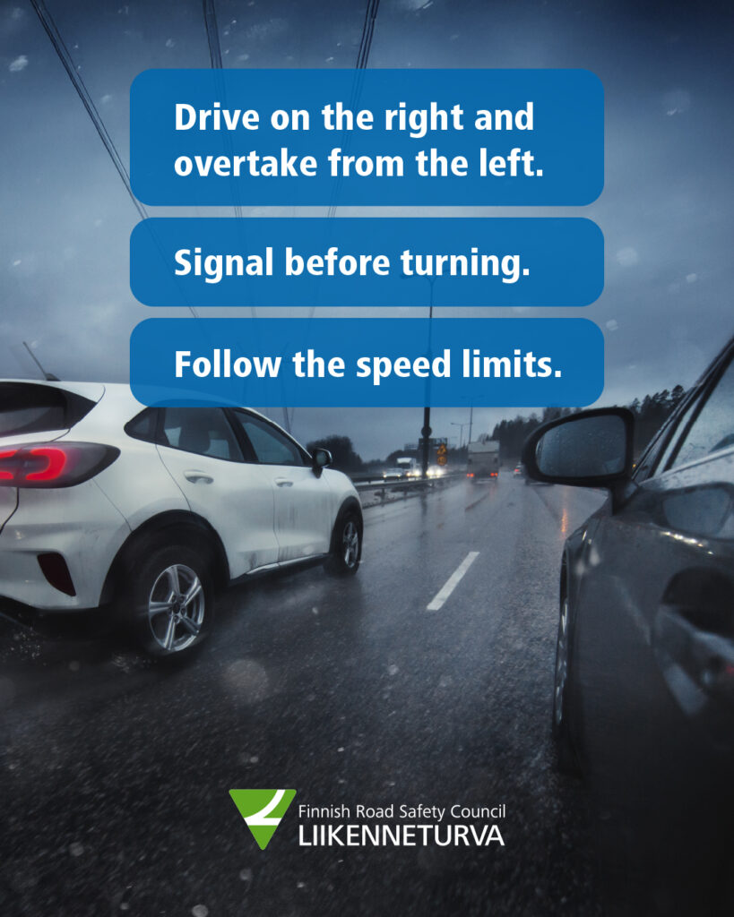 Two cars driving side by side.